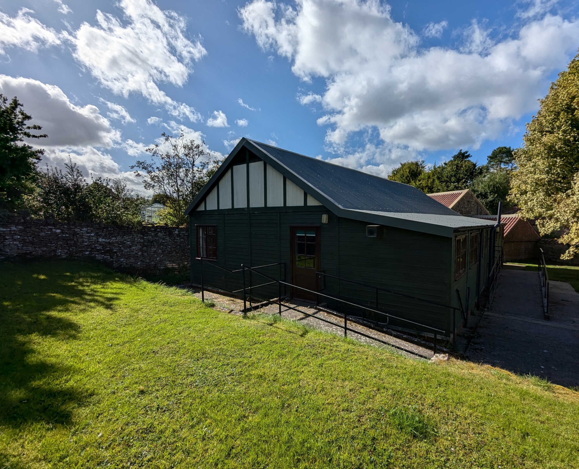 Village Hall under a blue sky.